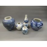 Chinese double gourd shaped vase, blue and white decorated with figures, signed with four