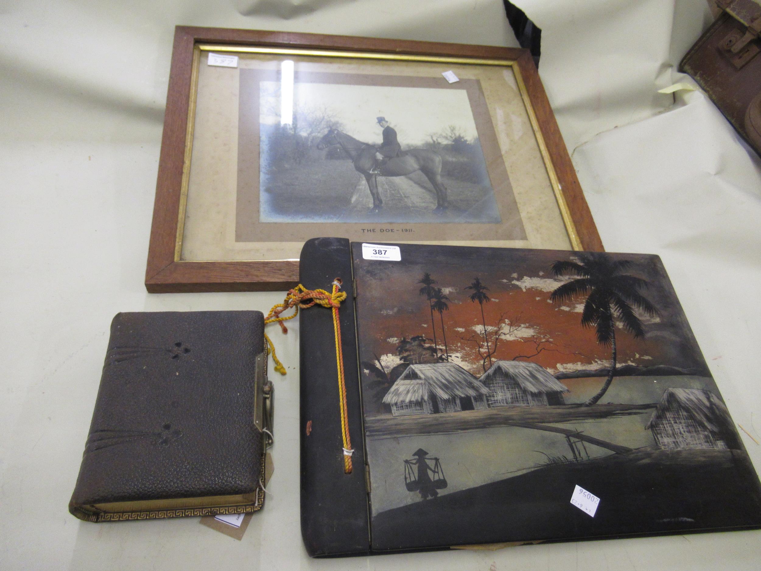 Early 20th Century Japanese black lacquered, chinoiserie decorated photograph album, containing a