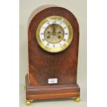 Mahogany dome shaped mantel clock, with brass dial, enamel chapter ring, Roman numerals, two train