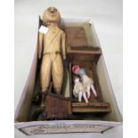Naive carved wooden doll, two miniature bisque dolls and a quantity of dolls house furniture