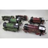 Four Hornby 0-4-0 0 gauge tank engines, together with two others (at fault)