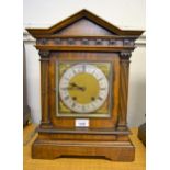 Late 19th / early 20th Century walnut cased two train mantel clock with an architectural case, 41cms