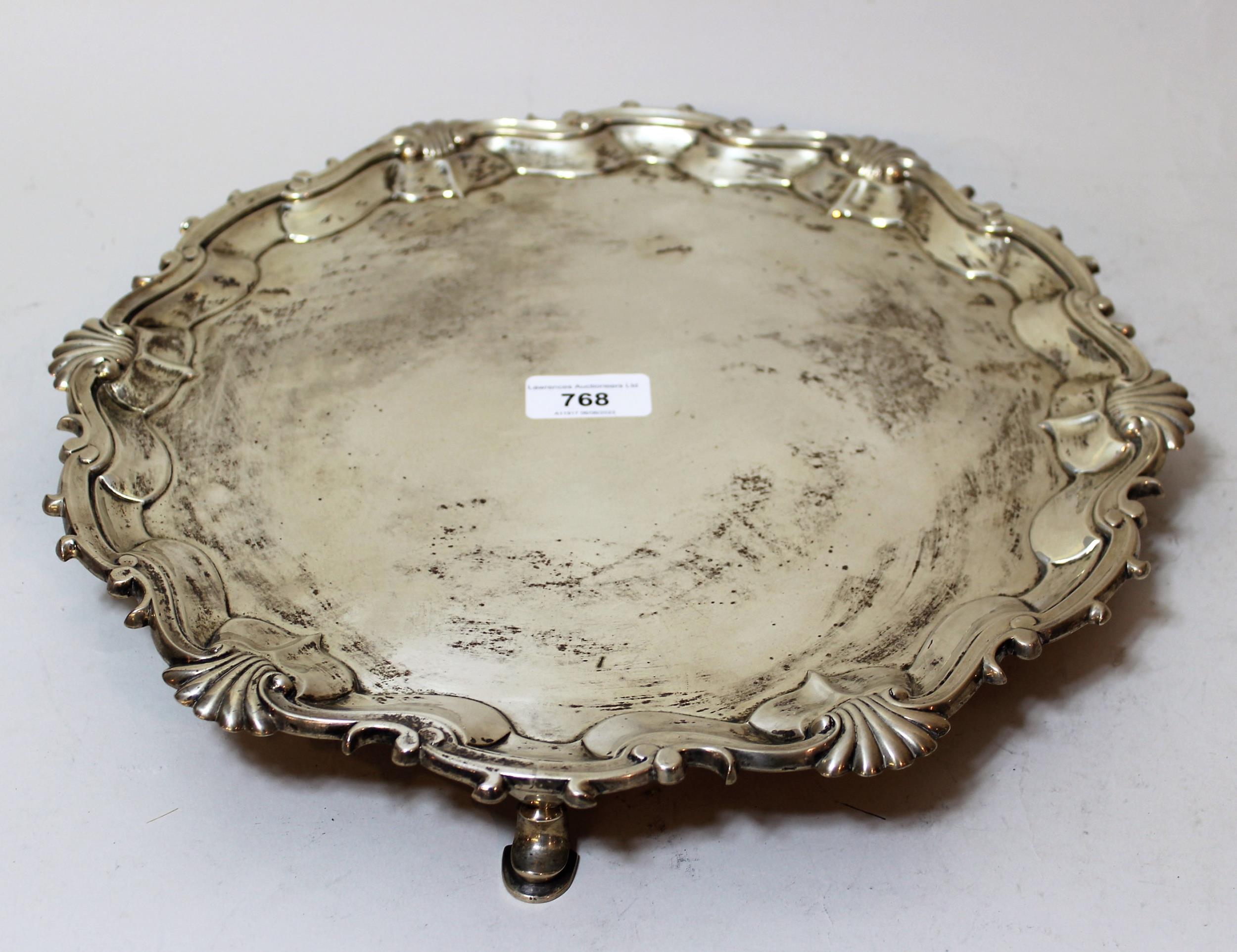 George II silver salver, the shaped moulded shell pattern rim enclosing a plain centre panel, raised