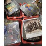 Four boxes containing a large collection of 1950's-1980's Rock and Pop LPs They are all in plastic