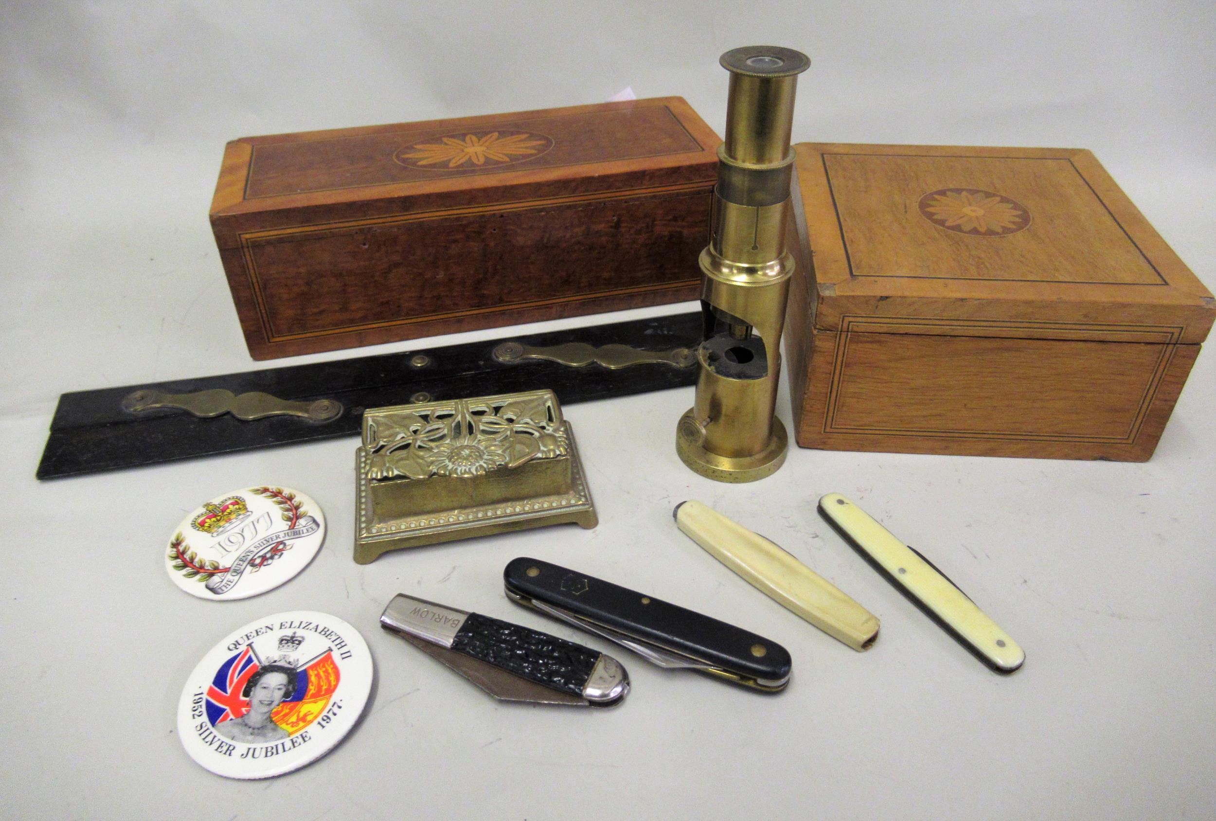 Late 19th / early 20th Century brass field microscope, brass double stamp box, four pen knives, an