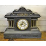 Large 19th Century black slate and brass mounted mantel clock, the enamel dial with Roman numerals