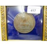 Small framed bronzed medallion commemorating the Battle of Maringo