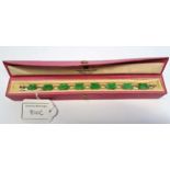 9ct White gold and jade set alternating panel design bracelet, in original box, 11.6g gross weight