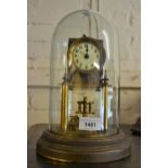 Brass three hundred day clock with glass dome and a 1930's oak two train mantel clock