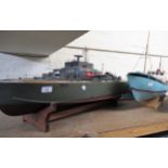 Radio controlled model torpedo boat, 103cms long overall, with stand and controller, together with
