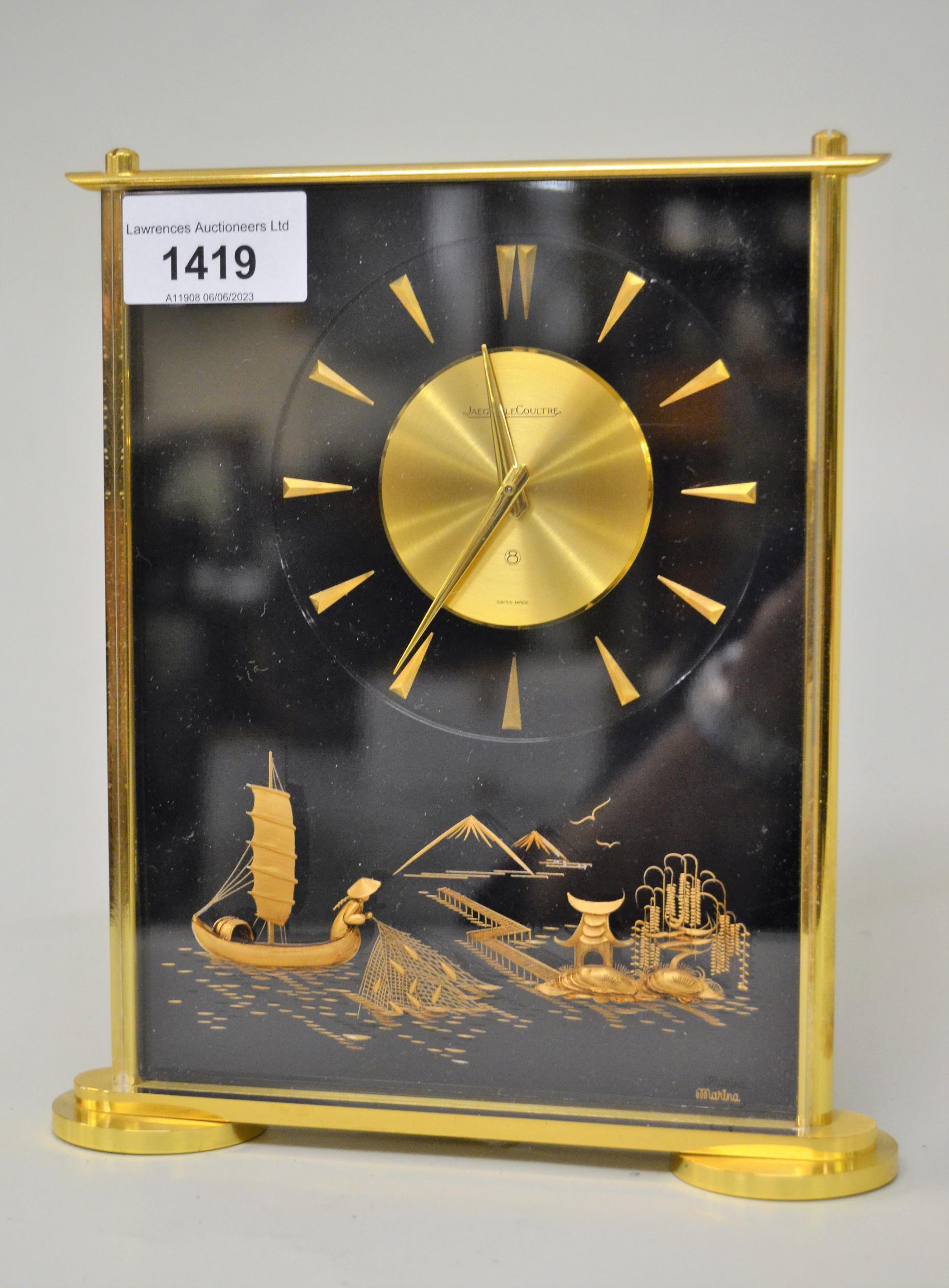 Jaeger LeCoultre 4188 Marina mantel clock with circular gilt dial, decorated in high relief with a