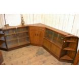 Mid 20th Century G-Plan modular dwarf bookcase comprising: two shelved units with sliding glass
