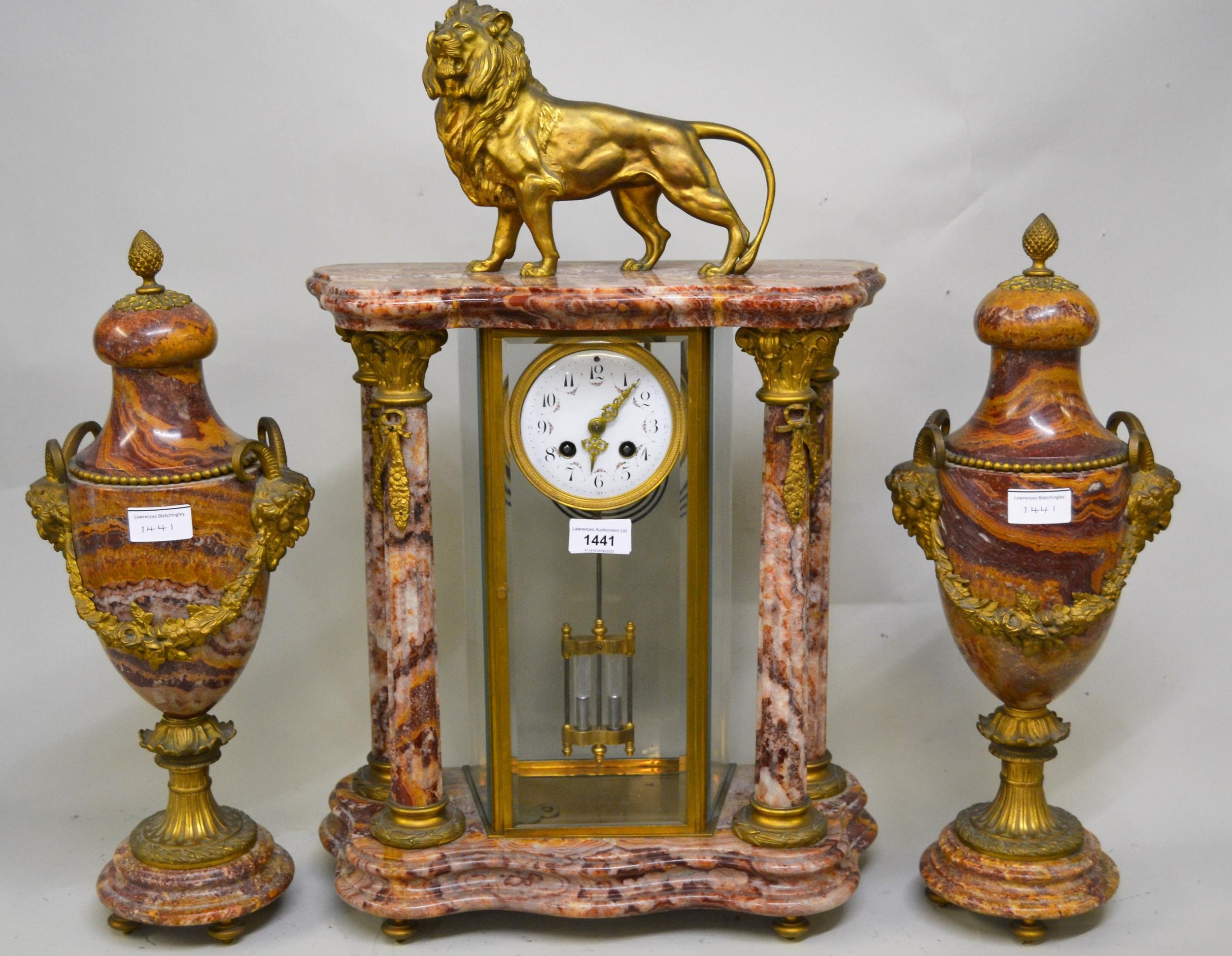 19th Century French pink flecked marble and ormolu mounted portico clock with lion surmount, the