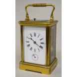 Early 20th Century brass cased carriage clock, the enamel dial with Roman numerals and subsidiary