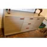 Modern grey finished sideboard, the three central drawers flanked by two cupboard doors on stile end