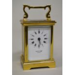 French gilt brass carriage clock, the enamel dial inscribed David W. Robb, Mitcham