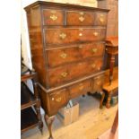 Walnut chest on stand in Queen Anne style, the moulded top above three short, three long and three