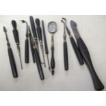 Group of twelve 19th Century dentistry tools, with ebony handles