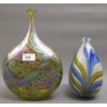 Contemporary studio glass bottle shaped vase with narrow neck decorated with an iridescent design,