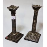 Pair of London silver Corinthian column candlesticks, 23cms high (for restoration), weighted