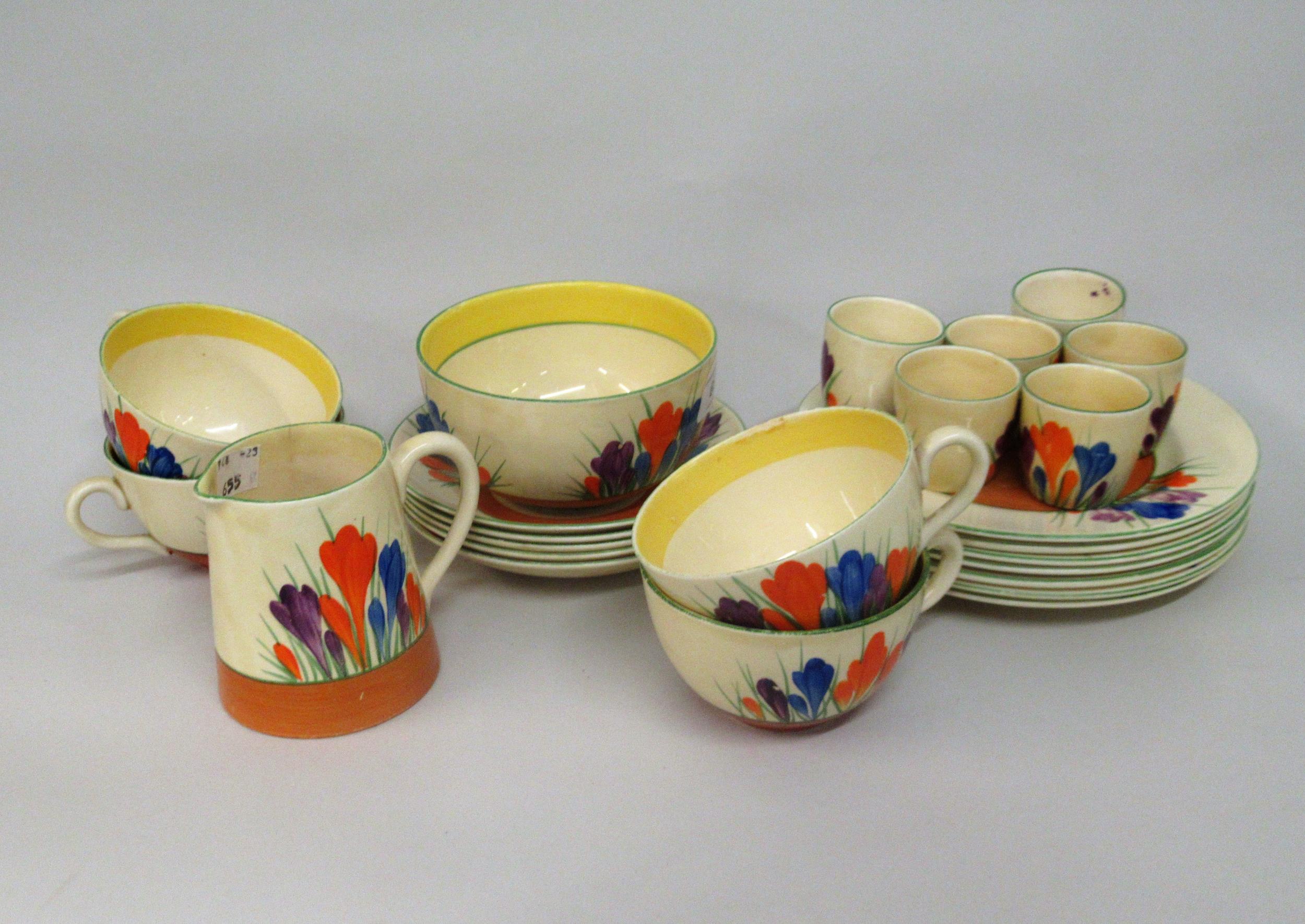 Clarice Cliff Crocus pattern part breakfast set comprising: seven side plates, five saucers, four