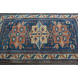 Modern Turkish rug of Caucasian design with a triple medallion on a blue ground with borders, 180cms