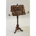 Victorian figured walnut duet music stand, the shaped fretwork top with brass articulated candle