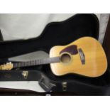 20th Century Ibanez performance six string acoustic guitar model No.PF-40, with strap and housed