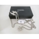 Chanel, metal chainlink belt, the logos embellished with heart shaped crystals, with a Chanel box In