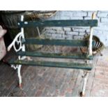 Small 20th Century two seat garden bench having cast iron ends with white painted finish and slatted