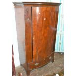 Small Edwardian mahogany bow fronted wardrobe with a moulded cornice, above a single line inlaid