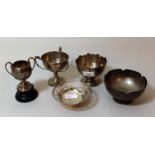 Miniature silver Birmingham silver pedestal rose bowl, two silver trophy cups, a silver dish with