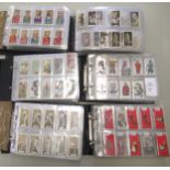 Six albums containing a collection of Scarcer odds of cigarette cards from manufacturers C