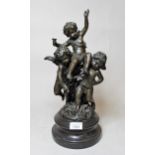 Reproduction dark patinated bronze group of three cherubs, 40cms high In good condition, no damage.