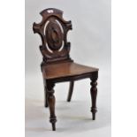 19th Century mahogany hall chair having carved pierced back and turned front supports