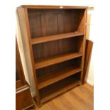 Late 19th Century Continental walnut open bookcase, the moulded top above adjustable shelves flanked