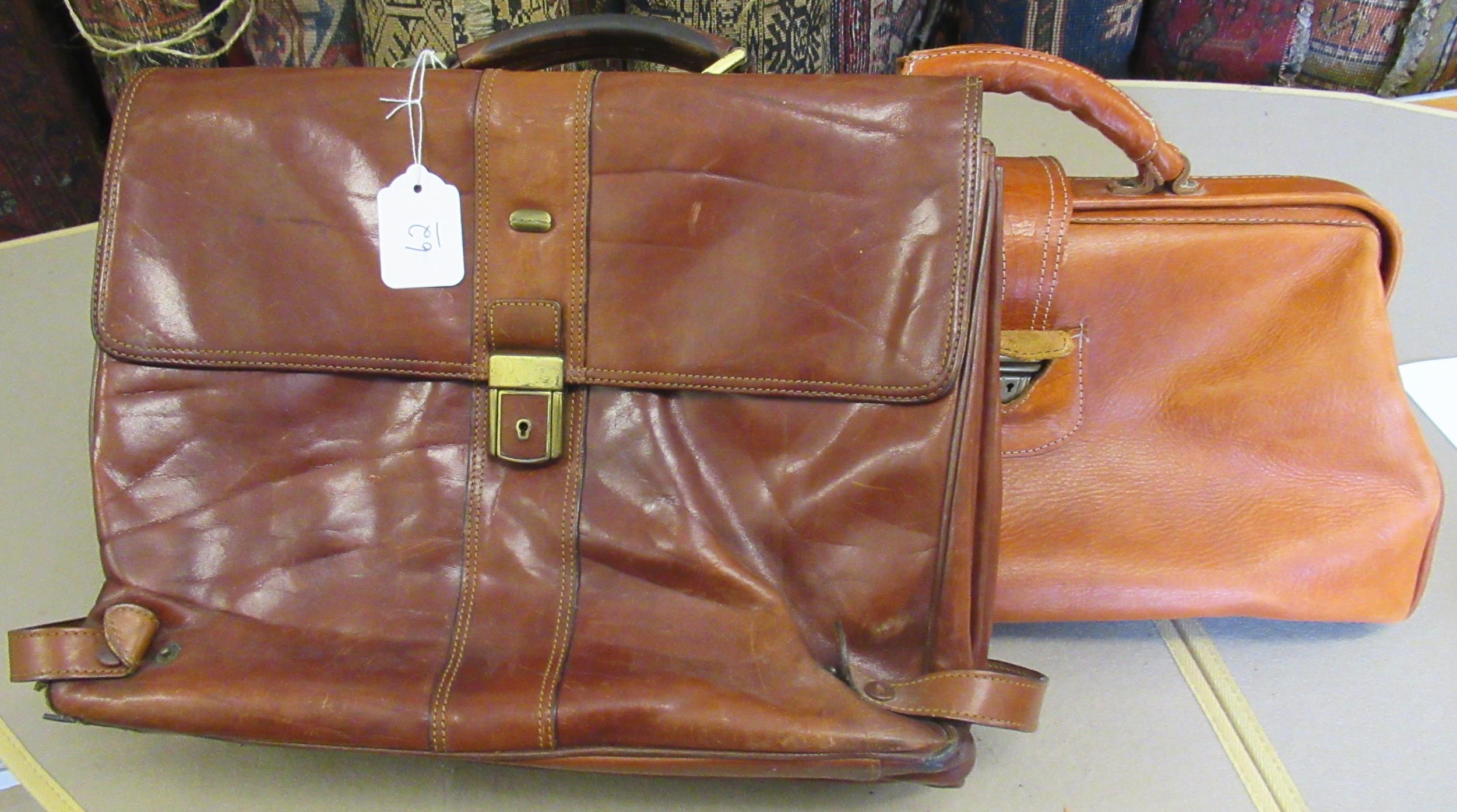 Tan leather attaché case by Piquadro, together with another leather briefcase Condition as shown