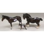 Two Beswick figures of horses (small chip to ear of small horse), together with another pottery