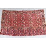 Antique Tekke Juval with five rows of five gols on a wine ground with borders and skirt panel, (