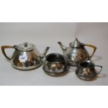 Liberty & Co. English pewter teapot of Arts and Crafts design with rattan handle, together with a