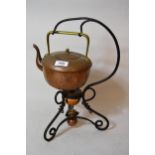 Benham and Froud beaten copper and wrought iron spirit kettle on stand, together with another