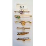 Five various 9ct and unmarked yellow metal bar brooches set various stones, two with metal pins,