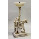 Early 20th Century carved alabaster table lamp, with tulip carved column support with figures of