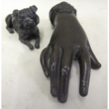 Small Victorian dark patinated bronze paperweight in the form of a female hand wearing a ring, 12cms