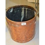 Hand beaten copper circular riveted and brass handled coal bucket, together with a brass folding