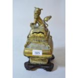 19th Century Chinese bronze censer on a hardwood stand, together with two seated figures of buddha