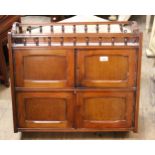 Small Victorian mahogany four door wall cabinet with a spindle galleried top, 63.5cms wide