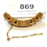 15ct Yellow gold ruby sapphire and diamond set crescent shaped brooch (safety chain at fault) Length