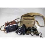 Pair of Wray London, black japanned and brass binoculars in canvas case and two cased cameras