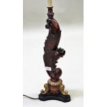 Reproduction carved and parcel gilt table lamp of scroll design with tripod base, 55cms high